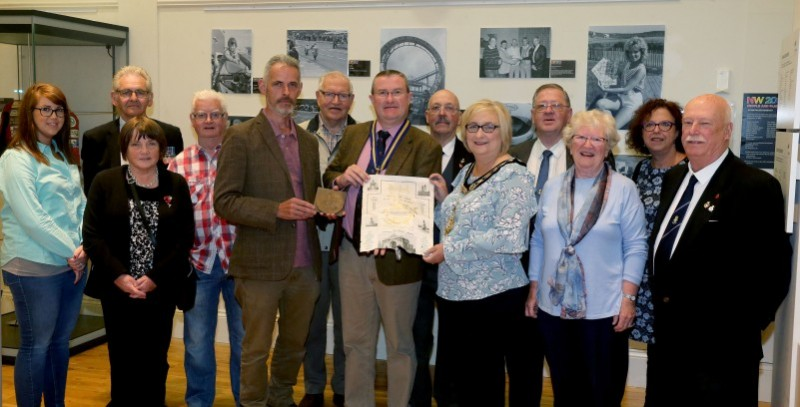 The Mayor of Causeway Coast and Glens Borough Council Councillor Brenda Chiver with members of Ballymoney RBL, Museum Services staff, Andrew Barrett who found the items and Kathleen Connolly, local family history researcher.