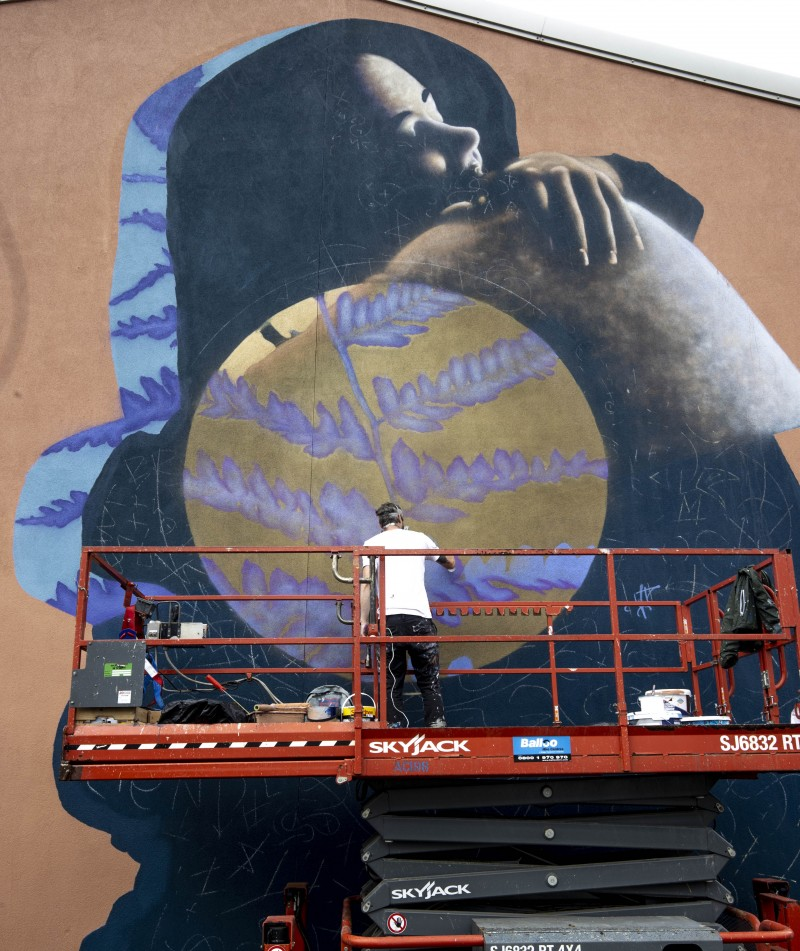 Artist EMIC hard at work creating his stunning mural at Queen’s Street, Coleraine.