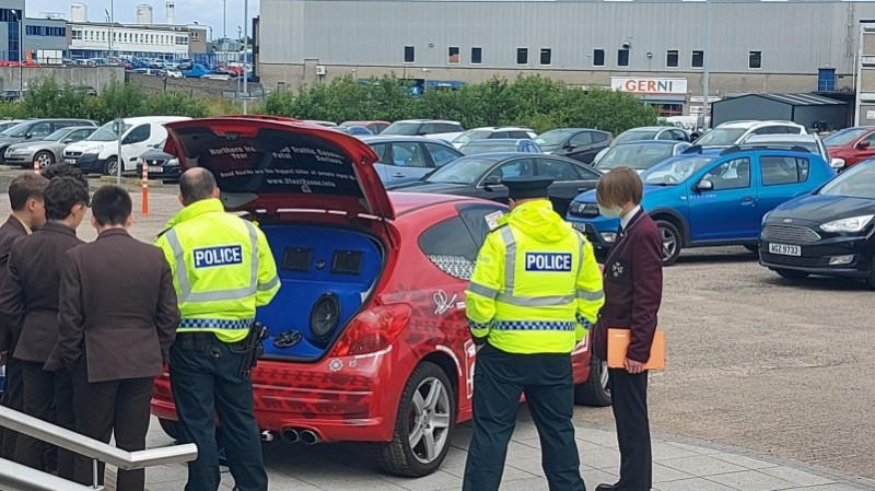 Police Officers show young people the 2 Fast 2 Soon vehicle which is part of the Causeway Coast and Glens PCSP road safety initiative.