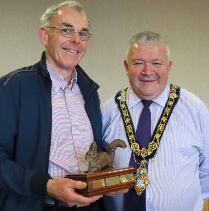 Gerard McCaughan, with his Volunteer of the Year award received from the Red Squirrel Survival Trust, pictured with the Mayor of Causeway Coast and Glens Borough Council, Councillor Ivor Wallace.