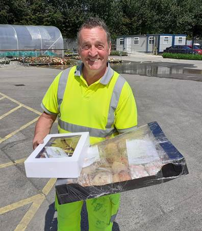 Causeway Coast and Glens Borough Council Operations employee George Elliott pictured with scones and tray bakes which were delivered to Limavady Depot by Roe Rover Football Club as a token of thanks for frontline workers earlier this year.