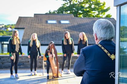 The Mayor of Causeway Coast and Glens Borough Council, Councillor Richard Holmes, enjoys the performance from the Scór na nÓg set-dancing team from Glenullin GAC