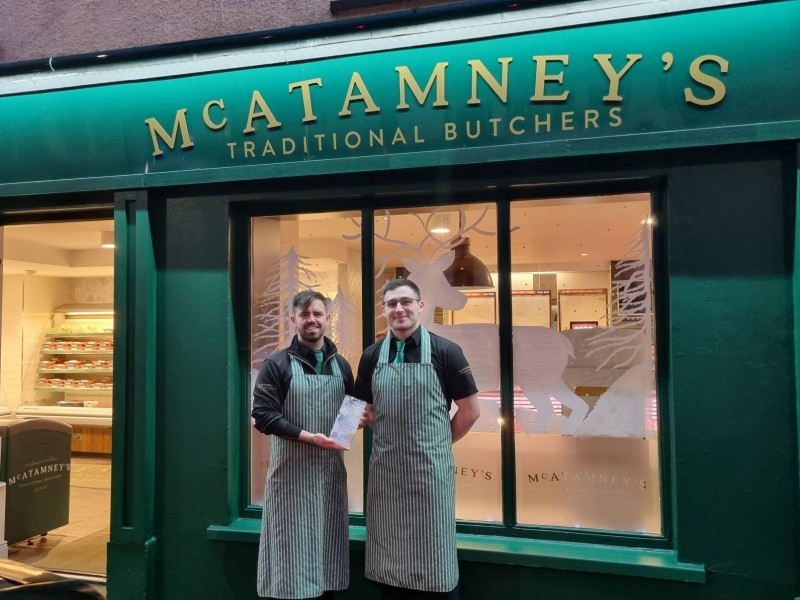 McAtamney’s staff proudly presenting their Christmas window display