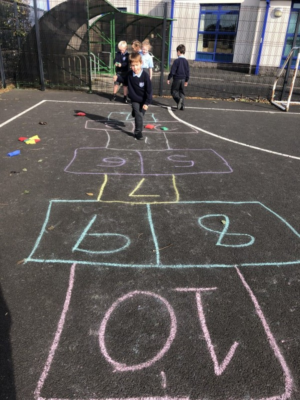 Enjoying a game of hopscotch during the Heritage Games at Carnalridge Primary School, Portrush.