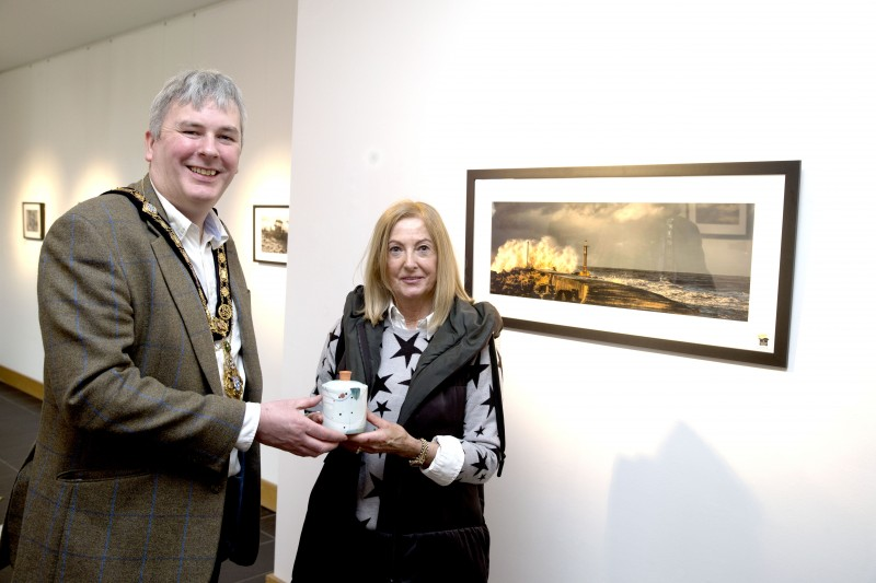 The Mayor of Causeway Coast and Glens Borough Council Councillor Richard Holmes pictured with the winner of the photography competition Marie Ward-Foster