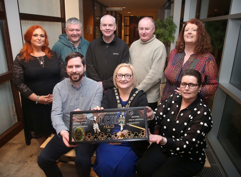 The Mayor of Causeway Coast and Glens Borough Council Councillor Brenda Chivers celebrates with participates of the Peace IV Cultural and Language Institutions programme.