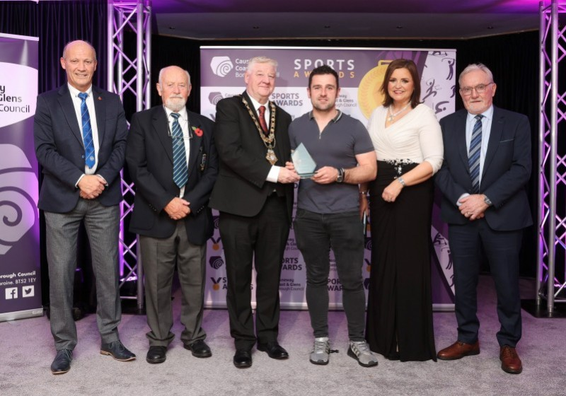 Road racing legend Michael Dunlop received this year’s Chairperson’s Award at the Causeway Coast and Glens Sports Awards. He is pictured at the gala awards event in the Lodge Hotel, Coleraine alongside Richard Briggs (Chair of Coleraine Sports Advisory Council), John McMullan (Chair of Ballymoney Sports Advisory Council), Tom Christie (Chair of Moyle Sports Advisory Council), host Denise Watson and Mayor of Causeway Coast and Glens, Councillor Steven Callaghan.