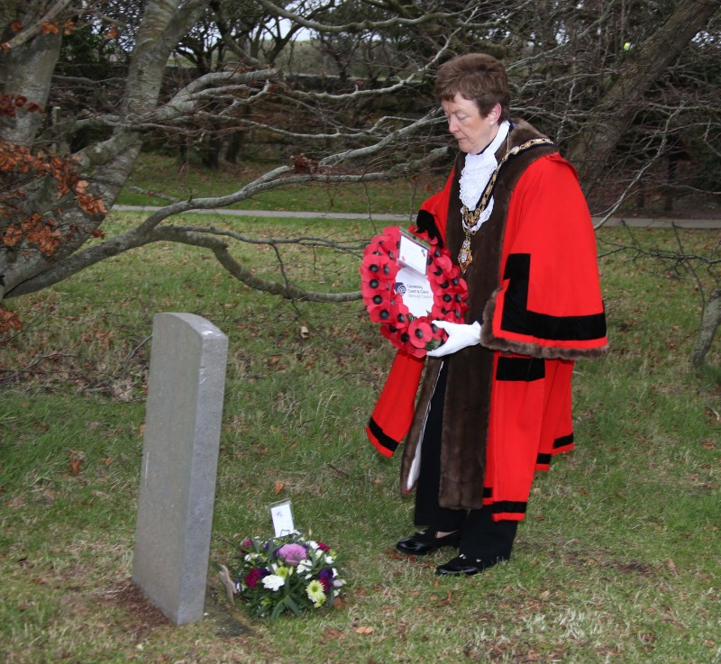 The Mayor of Causeway Coast and Glens Borough Council Councillor Joan Baird OBE lays a wreath at Bonamargy Friary.