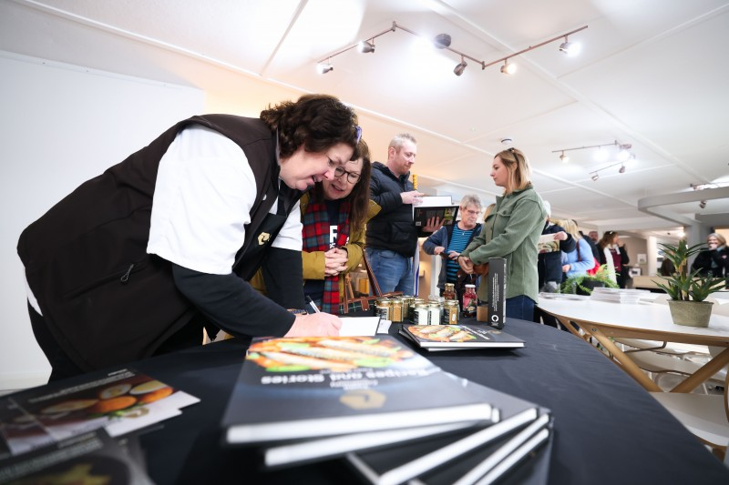 Paula McIntyre signs copies of her Taste Causeway book ‘Recipes and Stories’.