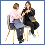 Two friends sitting in chairs signing to each other