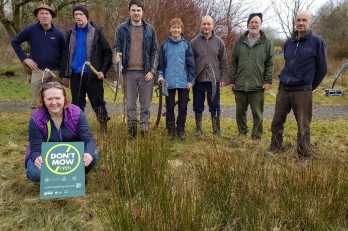 Volunteers experience scything in Ballymoney Riverside Park