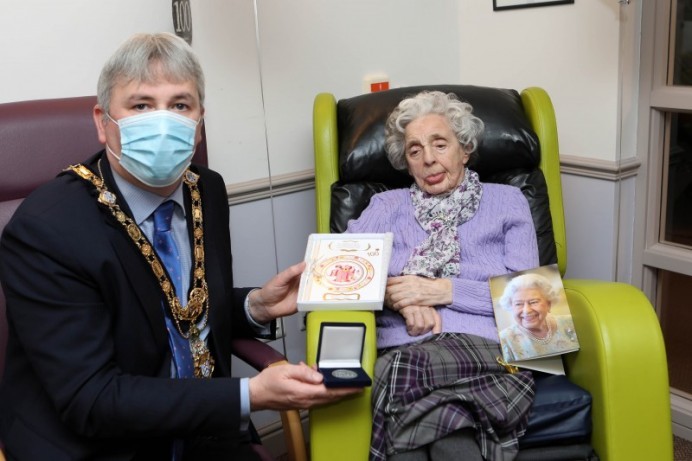 Centenary coin presented to resident of St James’ Lodge in Ballymoney